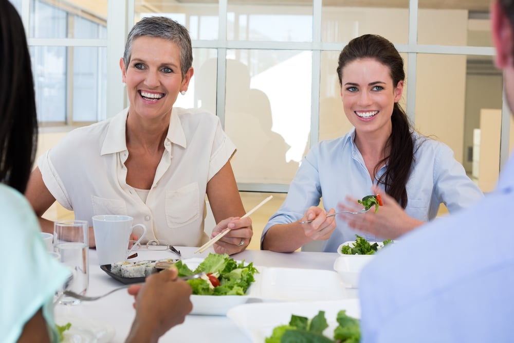 Business people enjoy healthy lunch in the office