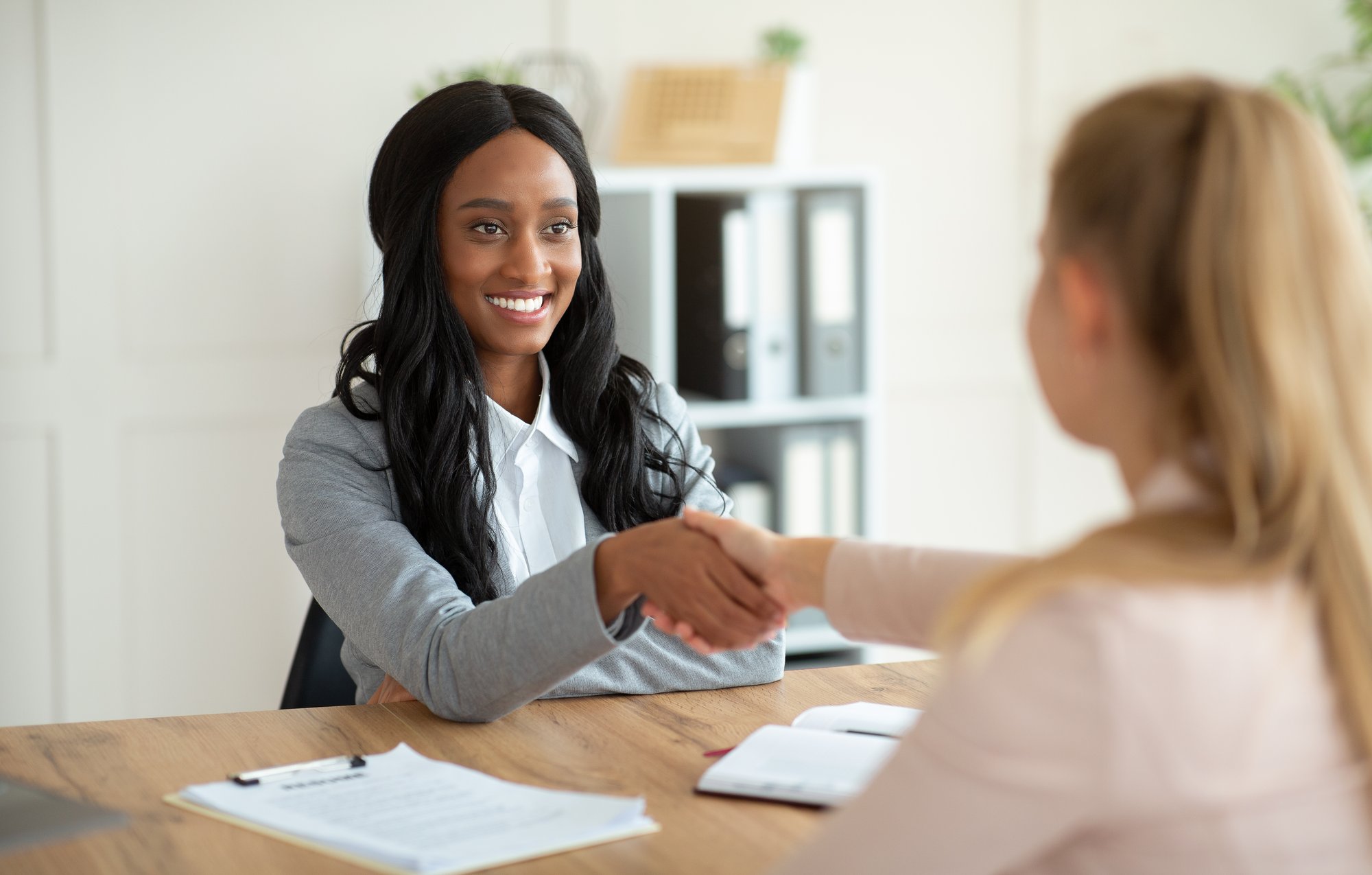Job seeker meeting a staffing recruiter to start a seasonal warehouse job in Salt Lake City