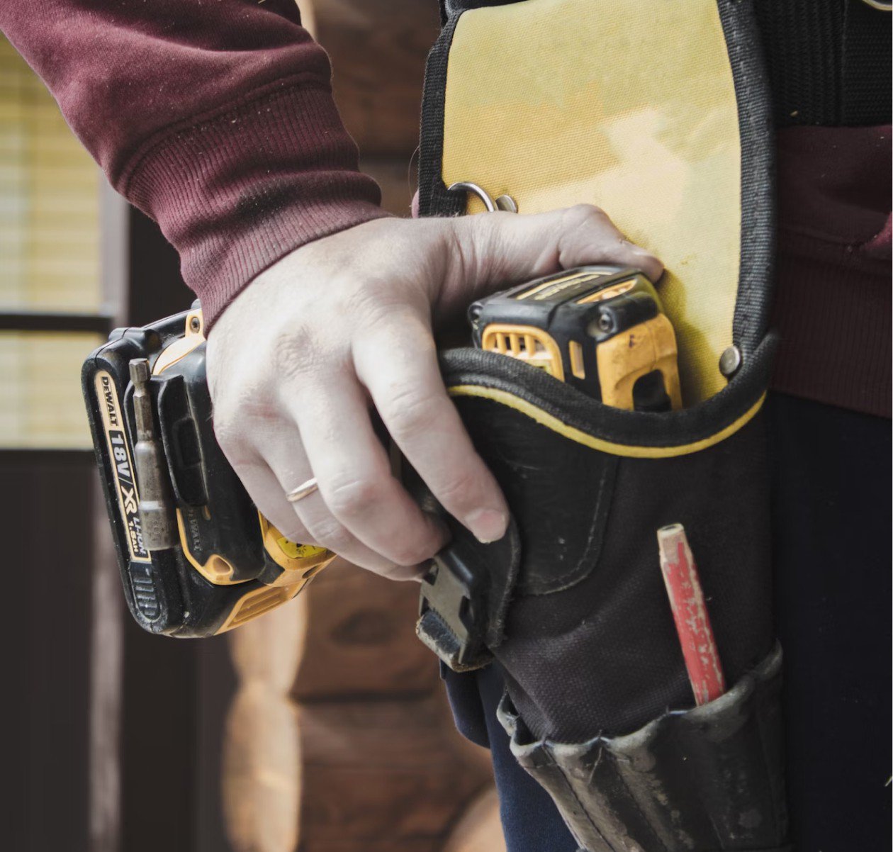 hand on drill on belt