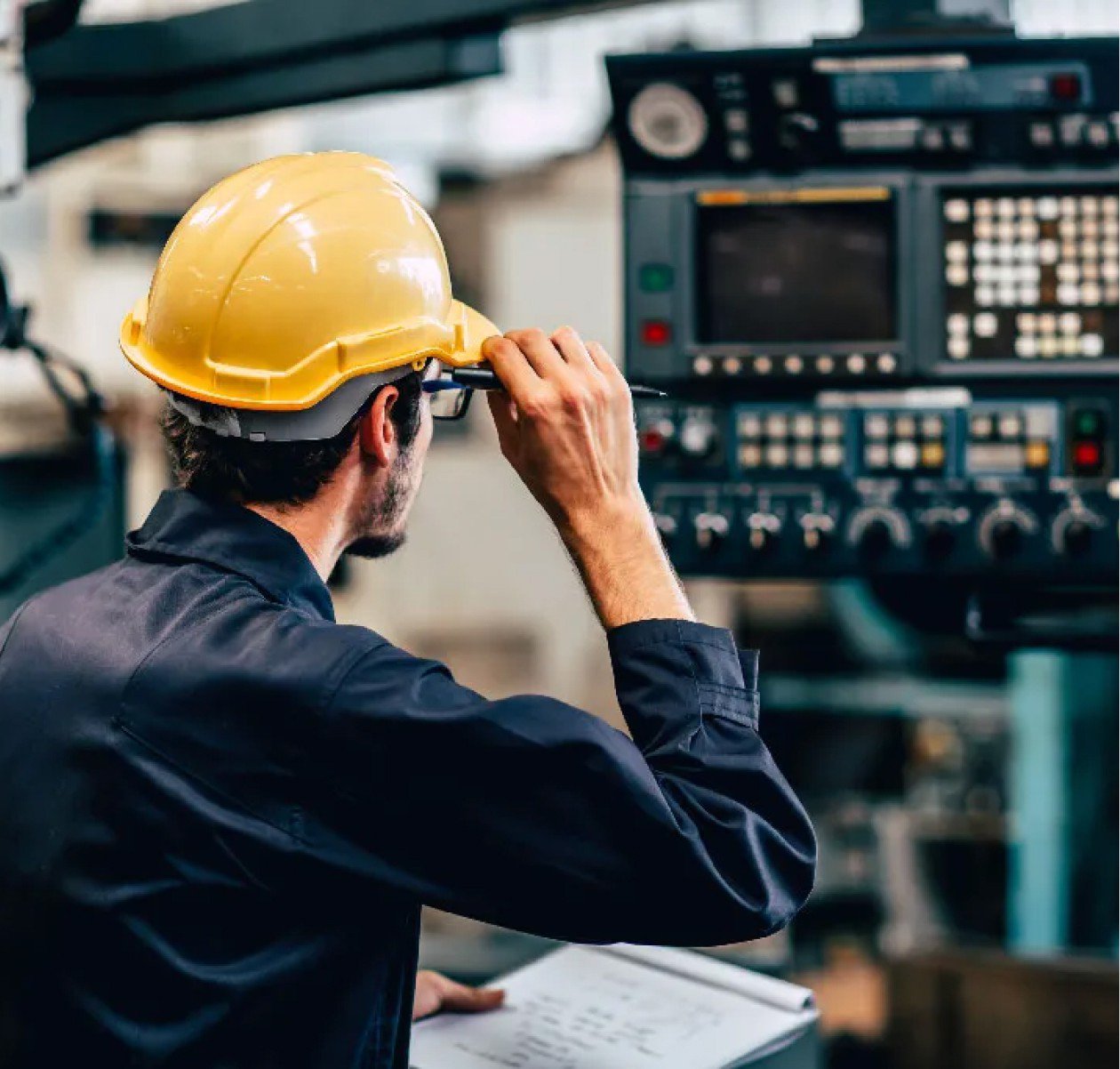 man examining equipment