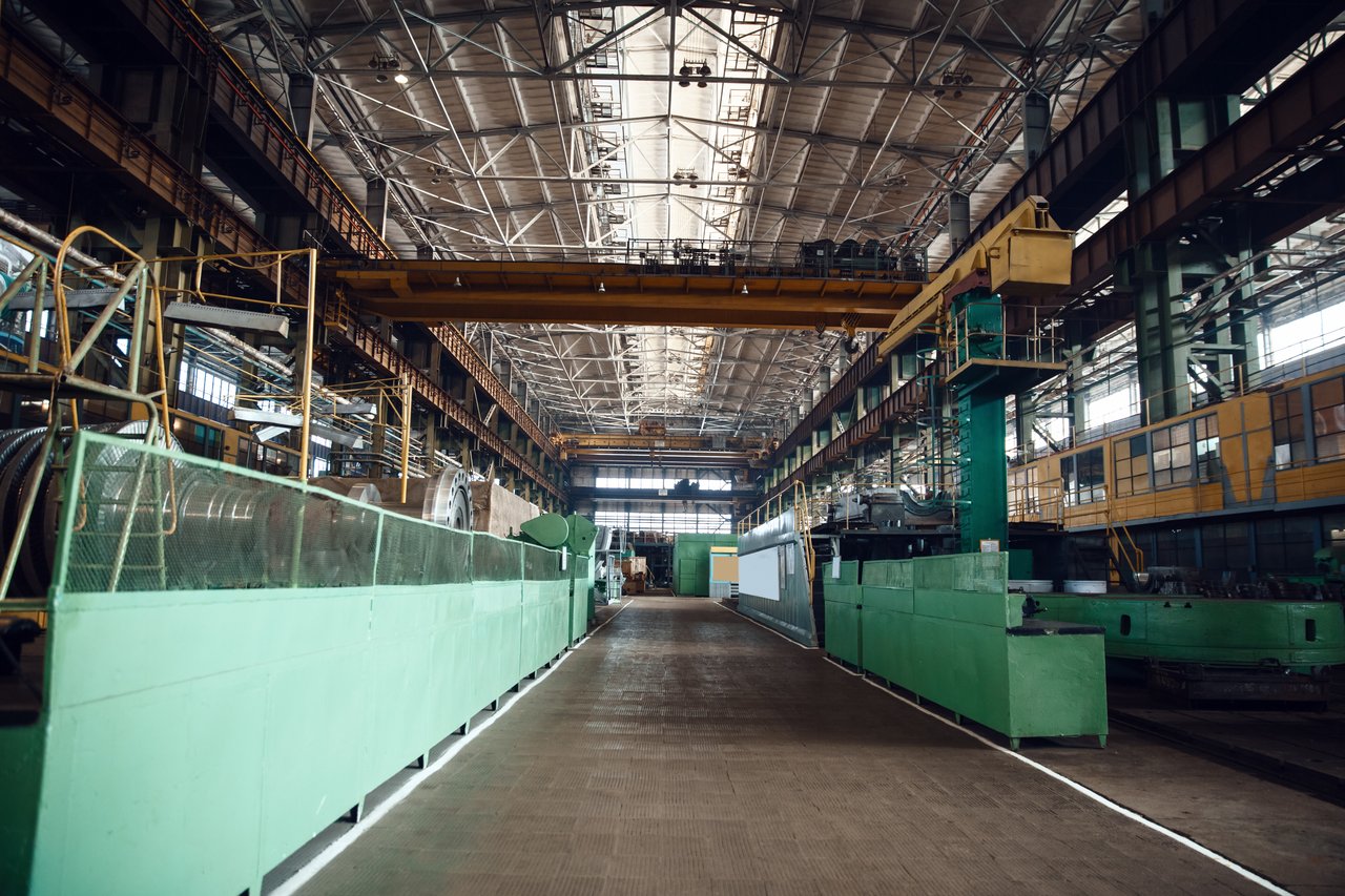 Empty manufacturing floor showing the cost of unfilled positions in a plant