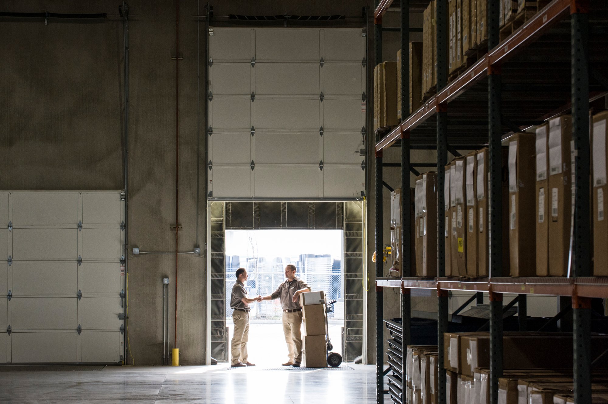 warehouse-handshake-deal-in-loading-bay-2026-03-25-03-29-10-utc