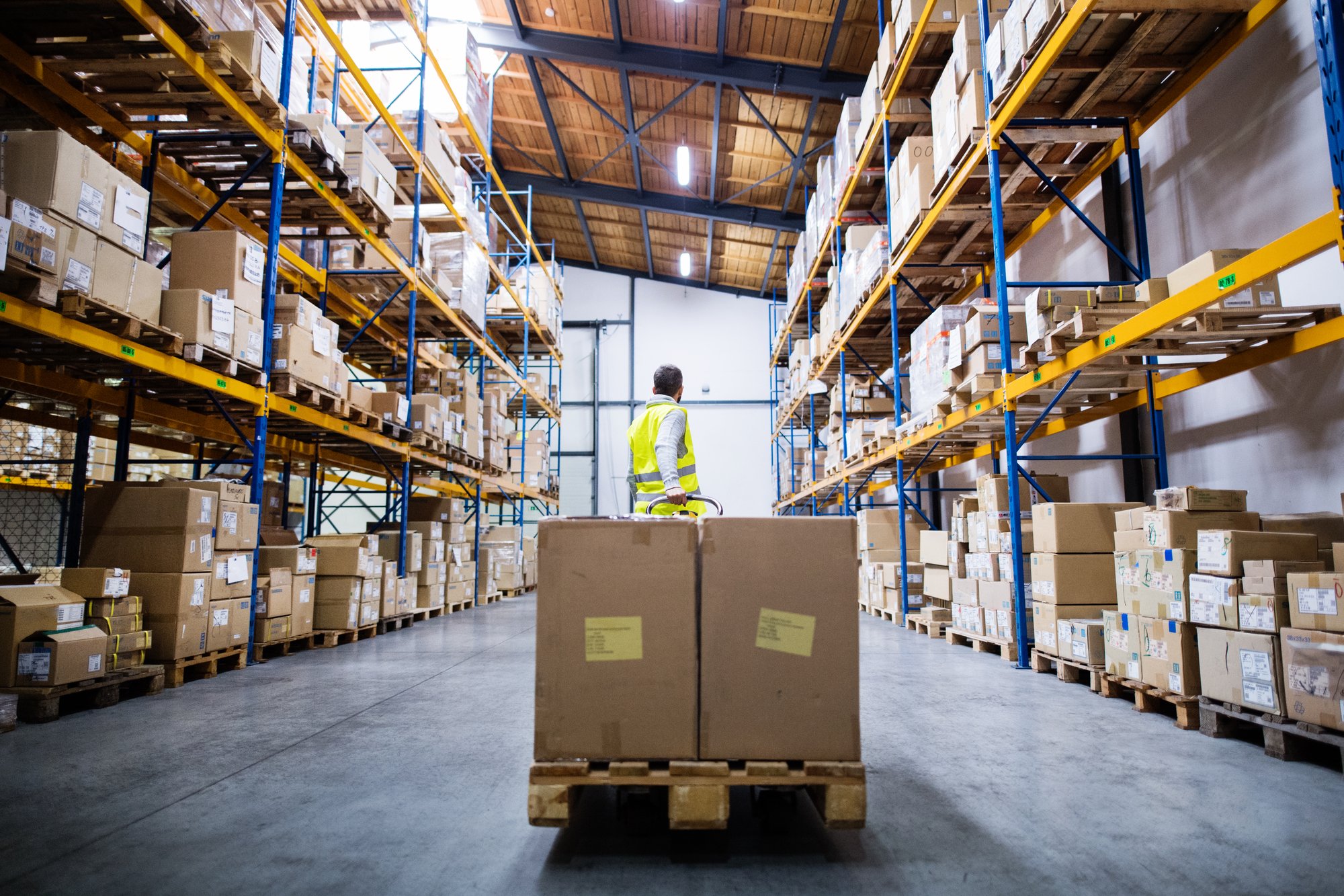 General warehouse worker moving a pallet jack, a common entry-level Utah warehouse job